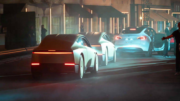 Conceptual autonomous vehicles moving through a city