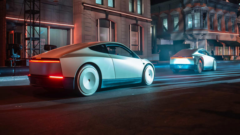 Conceptual autonomous vehicles operating in a city at night